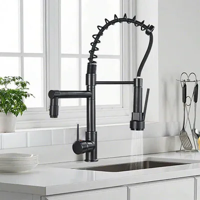 A black kitchen faucet with a pull-down sprayer is shown in a kitchen setting.