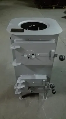 A gray metal stove is shown from a front-diagonal angle.