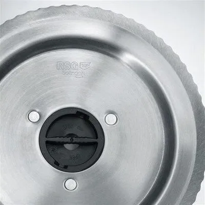 A close-up view of a circular metal blade with a serrated edge and a black central mechanism.