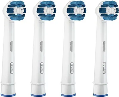 Four Oral-B toothbrush heads are lined up against a white background.