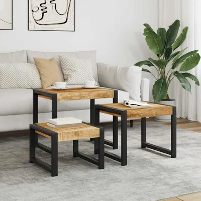 A living room scene with a sofa, coffee tables, and a plant.