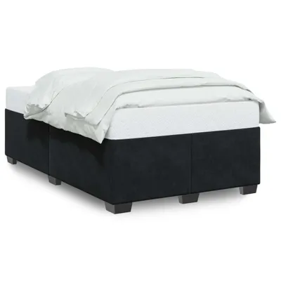 A bed frame with bedding on a white background.
