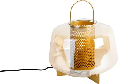 A table lamp with a gold metal interior and a translucent amber glass shade, set against a white background.