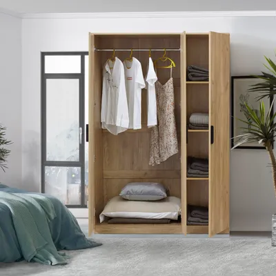 A bedroom scene with an open wardrobe.