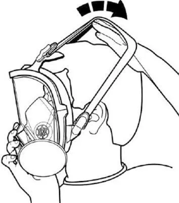 A person is putting on a full-face respirator mask.