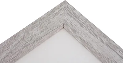 A close-up view of a corner of a picture frame with a wood-grain texture.