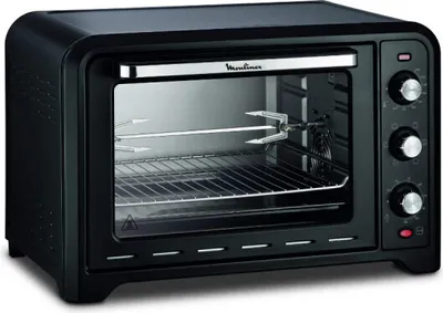 A black Moulinex oven with a rotisserie spit inside, shown from the front.