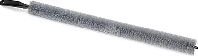 A long, bristled cleaning brush with a black handle, isolated on a white background.