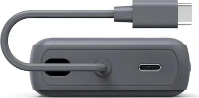A side view of a gray power bank with a USB-C cable attached.