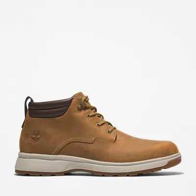 A single brown Timberland Chukka boot shown from the side against a white background.