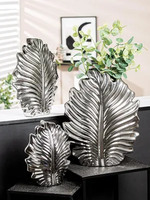 Imagen del producto de Jarrón Gilde, diseño "Hoja", "Monstera", cerámica, color plateado, unidad de venta: 2, largo: 9,5 cm, ancho: 23 cm, alto: 30 cm. Código: 47483. Número de artículo: 4063387474839
