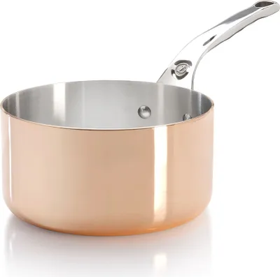 A close-up studio shot of a copper saucepan with a silver handle, set against a white background.