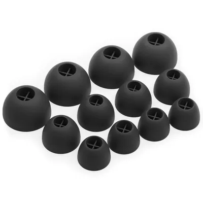 A collection of black silicone earbud tips arranged on a white background.