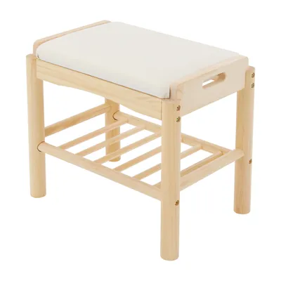 A wooden shoe bench with a white cushion on a white background.
