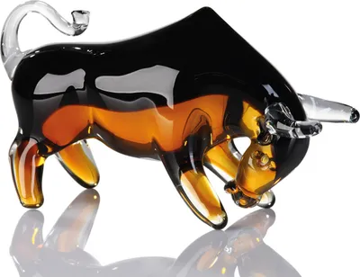 A glass figurine of a bull on a white background.