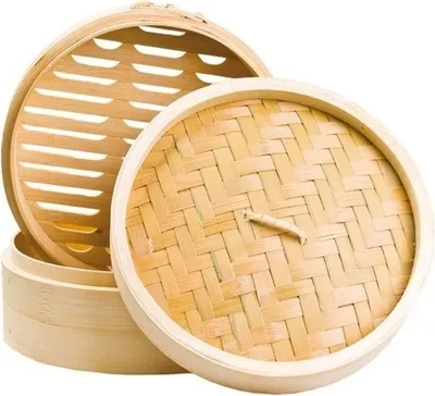 A bamboo steamer set with two tiers and a lid, shown against a white background.