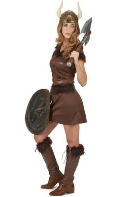 A woman dressed in a Viking costume, holding a shield and an axe.