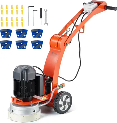 A concrete floor grinder with accessories on a white background.