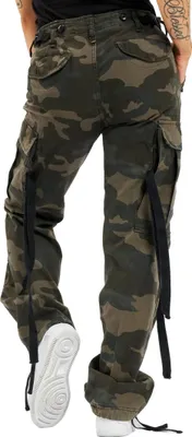 A person wearing camouflage cargo pants and white sneakers, shown from the back.