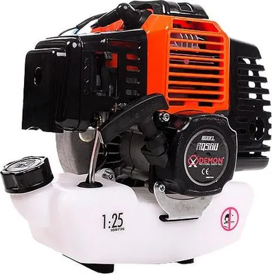 A close-up studio shot of a gasoline engine for a trimmer or weed whacker.