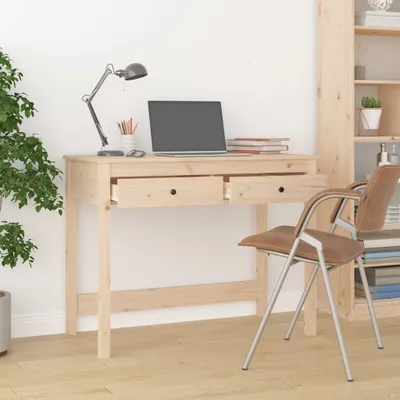 A wooden desk with a laptop, lamp, and chair in a room with a bookshelf.