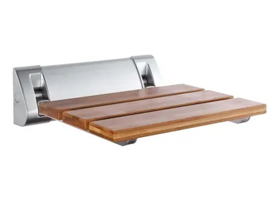 A wall-mounted folding shower seat with a wooden seat and silver metal frame.