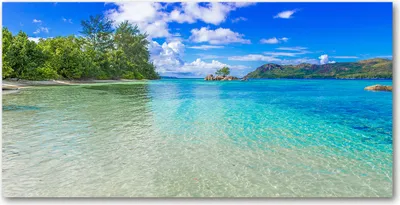 Produktbild von Tulup® Leinwandbild -100x50 cm - Wandkunst - Drucke auf Leinwand - Leinwanddruck  - Landschaften - Blau - Seychellen Strand