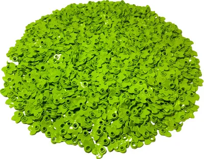 A pile of small, green, flower-shaped plastic pieces.