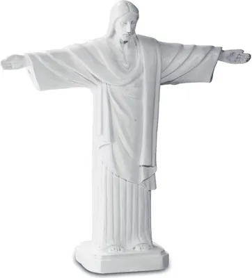 A white statue of Jesus Christ with outstretched arms, standing on a base.