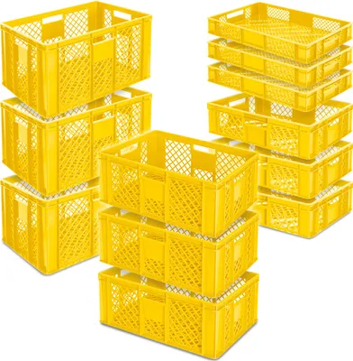 Stacks of yellow plastic crates are arranged in groups against a white background.