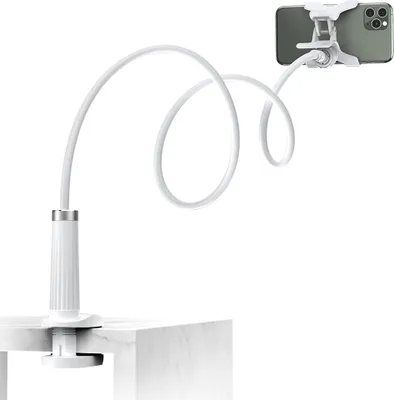 A white flexible gooseneck phone holder clamped to a table, holding a smartphone.
