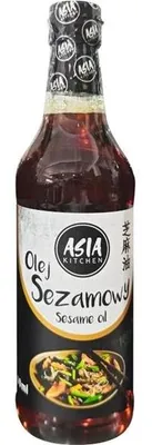 A bottle of sesame oil with a label showing the brand and product name.