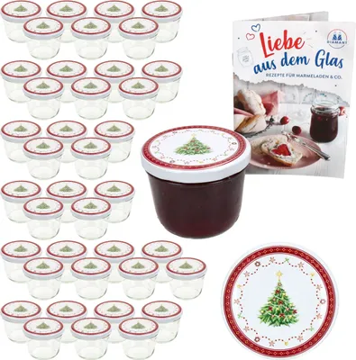 A set of glass jars with lids, a jar of jam, a recipe book, and a decorative plate, all with a Christmas theme.