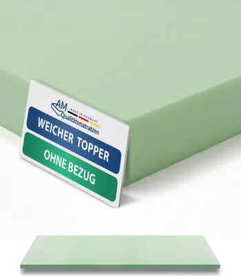 A light green mattress topper is shown at an angle, with a label in the foreground. A second, flat topper is shown below.