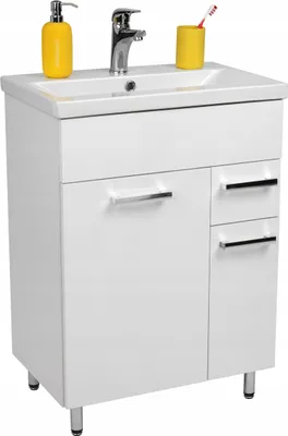 A white bathroom vanity with a sink, faucet, soap dispenser, and toothbrush holder.