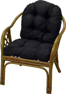 A black cushion on a rattan chair.
