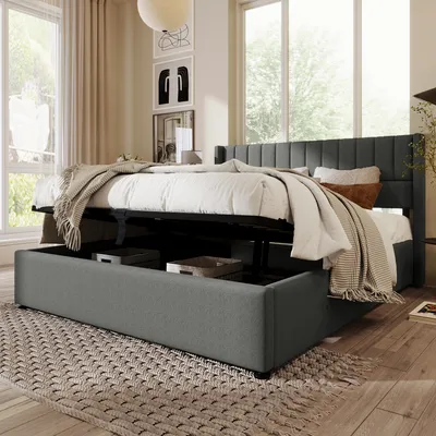 A bedroom scene with a bed that has storage underneath.