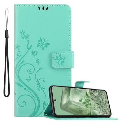 A turquoise flip phone case with a floral design and a smartphone inserted into it.