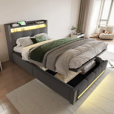 A bedroom scene with a bed that has storage and LED lighting.