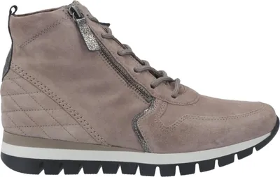 A side view of a beige high-top sneaker with a zipper and laces.