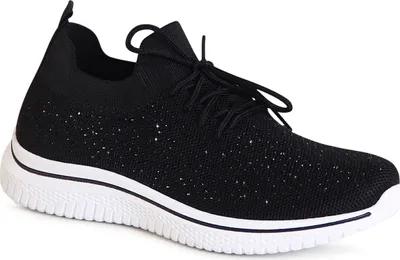 A single black sneaker with white accents on a white background.