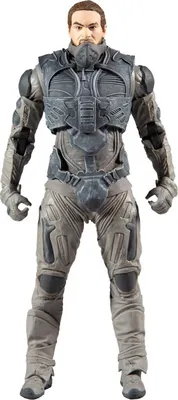 A full-body studio shot of a male action figure.