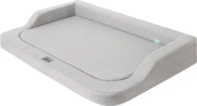 A light gray pet bed with raised edges, shown from a diagonal angle against a white background.