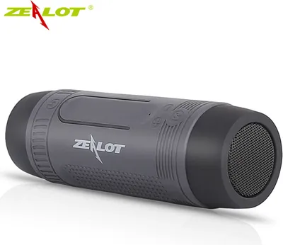 A gray cylindrical Bluetooth speaker with black ends, shown on a white background.