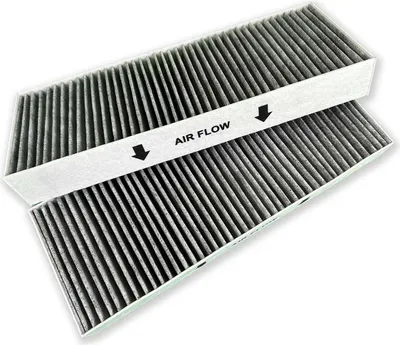 Two car air filters are stacked on top of each other against a white background.