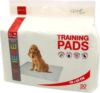 A package of dog training pads with a puppy on the front.