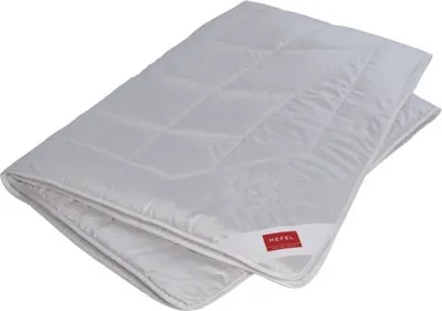 A folded white duvet is shown on a white background.