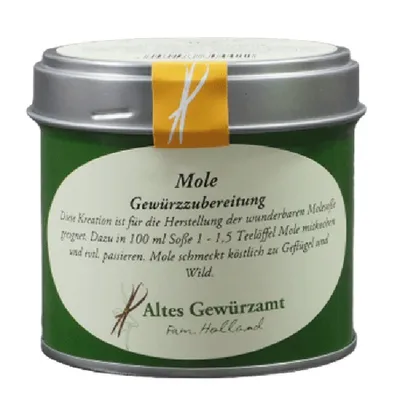 A green tin can with a white label and a yellow band, containing spice.
