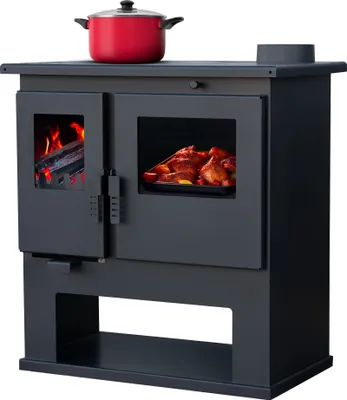 A black wood-burning stove with a red pot on top and a roasted chicken inside the oven.