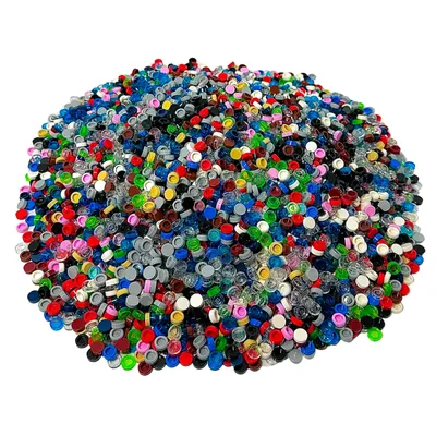 A large pile of small, colorful LEGO® 1x1 round tiles.